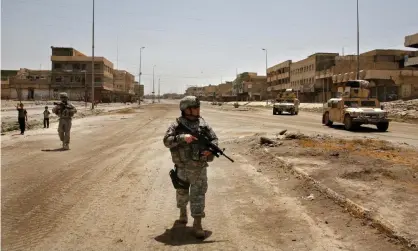  ??  ?? American soldiers in Mosul, Iraq. An estimated 9.2m people have been displaced in the country since the US-led war began. Photograph: Warrick Page/Getty Images
