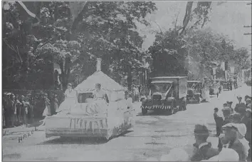  ?? FILE PHOTO ?? A 1932 photo showing the first Apple Blossom Festival float parade. The princess, left, on the float in the foreground is Hazel (White) Pulsifer.