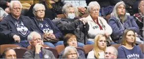  ?? Jessica Hill / Associated Press ?? Fans watch Saturday’s game between UConn and Temple in the American Athletic Conference tournament quarterfin­als at the Mohegan Sun Arena in Uncasville.