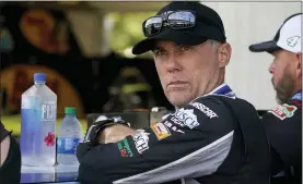  ?? ASSOCIATED PRESS FILE PHOTO ?? Kevin Harvick waits in his garage before a Cup Series practice earlier this year. Chase Elliott, according to Harvick, doesn’t race very smart. In fact, moving forward in NASCAR’S playoffs, Harvick plans to run all over the reigning Cup champion.