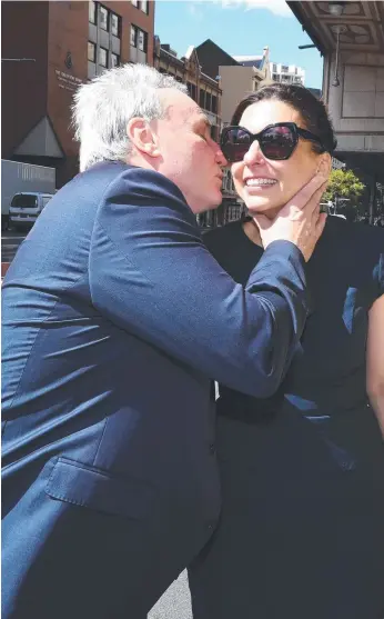  ?? Picture: AAP ?? Michael Cranston kisses his wife Gloria after leaving the Downing Centre Courts in Sydney yesterday where he was found not guilty of misusing his position to help his son.
