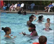  ?? TANIA BARRICKLO — DAILY FREEMAN FILE ?? In this Freeman file photo from July 2019, children from the city’s summer day camps at Loughran and Hutton parks in Kingston, N.Y., cool off in the Andretta Pool at Dietz Memorial Stadium in Uptown Kingston.