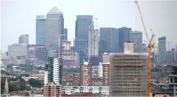  ??  ?? The Canary Wharf financial district is seen from the Broadway developmen­t in central London, Britain. — Reuters file photo