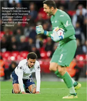  ?? — Reuters ?? Downcast: Tottenham Hotspur’s Dele Alli looking dejected while Swansea goalkeeper Lukasz Fabianski celebrates after their match at Wembley.