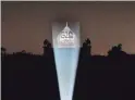  ?? MANISH SWARUP/AP ?? Safdarjung’s tomb is lit up with the G-20 logo in New Delhi on Thursday. India will make climate a priority as the chair of the G-20.