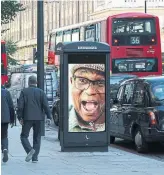  ?? JANE STOCKDALE THE NEW YORK TIMES ?? New phone booths display ads and offer Wi-Fi in London, but have set off a battle over public space.