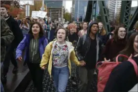  ?? BETH NAKAMURA — THE ASSOCIATED PRESS ?? Portland Public School students walk out of schools and converge on Pioneer Courthouse Square for a protest against the results of the presidenti­al election, on Nov. 14.