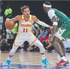  ?? Picture: AFP ?? Atlanta Hawks guard Trae Young tries to get the better of Milwaukee Bucks forward Bobby Portis.