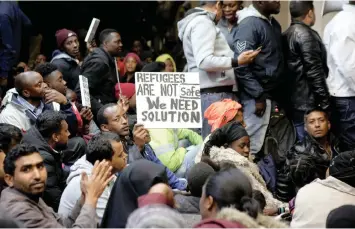  ?? African News Agency (ANA) ?? HUNDREDS of refugees including women and children from various African and Middle Eastern countries have been camped out in the foyer of the Waldorf Arcade in the CBD since Tuesday demanding to be resettled. | BRENDAN MAGAAR