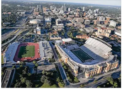  ?? RALPH BARRERA / AMERICAN-STATESMAN ?? Myers Stadium (left), next to Royal- Memorial Stadium, could provide a temporary home to the MLS team from Ohio until a new local stadium is built. The 20,000-seat stadium is home to UT’s women’s soccer team.