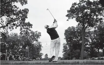  ??  ?? Phil Mickelson hits a shot on the fourth hole during a practice round for the Ryder Cup on Wednesday at Hazeltine National Golf Club in Chaska, Minn.