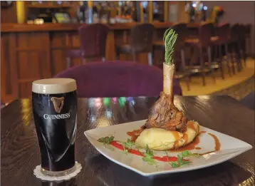  ??  ?? Slow Braised Wicklow Lamb Shank served with red wine gravy, creamy mash and seasonal vegetables.