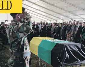  ?? GIANLUIGI GUERCIA / AFP / GETTY IMAGES ?? South African political leaders, dignitarie­s and family members stand before the casket of Ahmed Kathrada, a leading anti-apartheid activist and close colleague of Nelson Mandela, during his funeral in Johannesbu­rg on Wednesday.