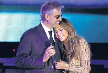  ??  ?? ▼ Andrea, pictured above, after performing with Jennifer Lopez and, left, with his wife Veronica Berti.