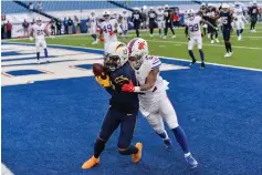  ?? Associated Press ?? ■ Los Angeles Chargers wide receiver Keenan Allen (13) catches a touchdown pass against Buffalo Bills cornerback Taron Johnson (24) Sunday during the second half of an NFL football game, in Orchard Park, N.Y.