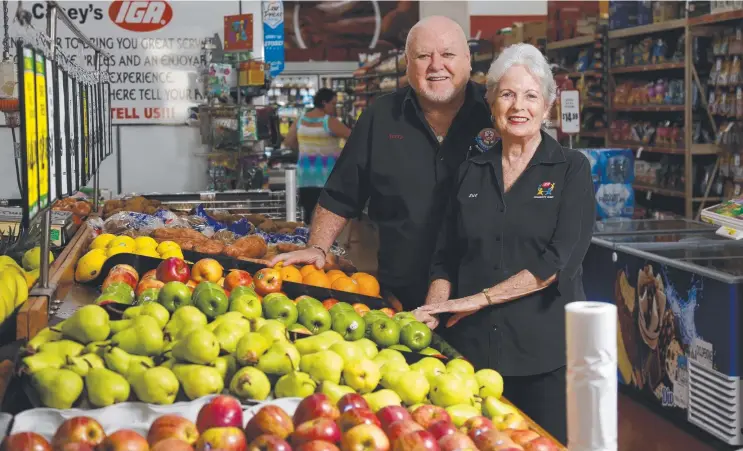  ?? Picture: STEWART McLEAN ?? MOVING ALONG: Terry and Sue Casey are selling the IGA at Woree, which they started running as the Big Tomato 26 years ago. At age 72, they think it's time to travel around Australia.