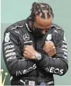  ??  ?? FORMULA One star Lewis Hamilton paid his respects to Boseman, on the podium in Belgium last weekend. | EPA