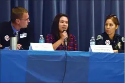  ??  ?? Student panel representa­tive Lexy Turrey, center, comments Wednesday as Dr. Anthony Martin of Burton School District, left, and Officer Amalia Johnson of Portervill­e Police Department, listen during the Bully Prevention Town Hall Meeting at Jim Maples Academy.