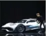  ?? UWE ANSPACH — DPA VIA AP ?? Formula One driver Lewis Hamilton arrives in a Mercedes-AMG Project One car during a press presentati­on at the Mercedes-Benz stand on the first media day of the Frankfurt Motor Show IAA in Frankfurt, Germany, Tuesday, Sept. 12, 2017. From frightenin­gly...