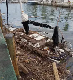  ??  ?? Hurricane Irma left a trail of destructio­n as the storm moved through the Caribbean and into Florida. This boat in Coconut Grove, Florida, nearly sank from all the debris.