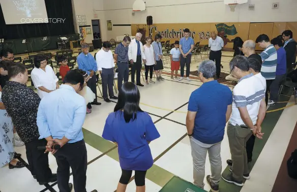  ??  ?? Members of the GCF–Peel congregati­on gather for prayer before the Sunday morning service.