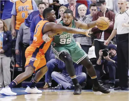  ??  ?? OKLAHOMA CITY: Boston Celtics forward Jae Crowder (99) drives to the basket as Oklahoma City Thunder guard Victor Oladipo (5) defends during the first half of an NBA basketball game in Oklahoma City, Sunday. — AP