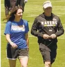  ?? COURTESY OF WMAR-2 NEWS ?? Erica Vinson-Ondecko, walking with Ravens specialist­s coach Randy Brown, will be one of three female coaches serving apprentice­ships this summer.