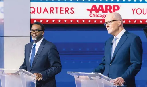  ?? ANTHONY VAZQUEZ/SUN-TIMES ?? Mayoral candidates Brandon Johnson (left) and Paul Vallas listen to moderators during a debate at WGN Studios on Tuesday.