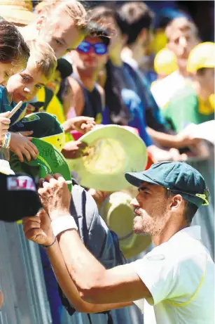  ??  ?? Fan favourite: Australia's pace spearhead Mitchell Starc obliges fans with autographs during day five of the second Test between Australia and India in Perth. The inclusive nature of Australian cricket was visible in the pre-match flight to Perth, when Tim Paine and other members of the home team signed miniature bats for two youngsters. No fuss, just a pure acknowledg­ment of a fan’s worth in sport’s value-chain. AFP