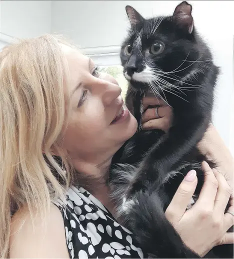  ??  ?? Foster, a diabetic cat with his foster mom Corinne Schindler. Schindler says people should not shy away from adopting cats with diabetes.