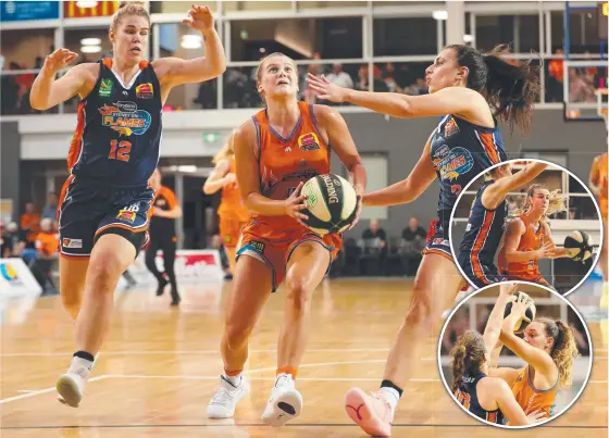  ??  ?? Townsville’s Shyla Heal flies between two defenders. INSET: Fire’s Steph Reid was massive off the bench; Megan Mckay.
Pictures: ALIX SWEENEY