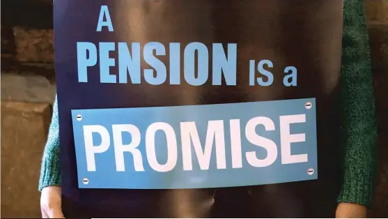  ?? | SETH PERLMAN/ AP FILES ?? A sign in support of fair pension reform at a 2013 rally at the Illinois State Capitol.