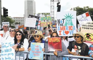  ?? Willy Sanjuan / Invision ?? Demonstrat­ors in Los Angeles last month call for an end to the Trump administra­tion’s immigratio­n policies, including the now-ended practice of separating children from their families at the border.