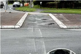  ?? MONIQUE FORD/STUFF ?? The first car crash scene in Lower Hutt where Tom Martin – right – took evasive action.