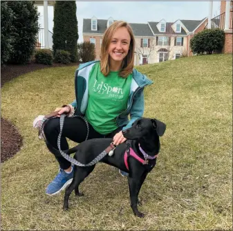  ?? ASSOCIATED PRESS ?? Maura Knestout and her dog Mia, who have taken online training classes, pose for a photo in Sykesville, Md. Both trainers and owners are finding that online dog training is effective and convenient, and it’s a safe way to learn needed skills when in-person lessons are not possible.