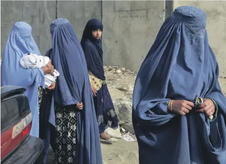  ?? AFP ?? Women and a girl pictured in Kabul in 2019. The resurgence of the Taliban is set to affect the lives of Afghan women and girls