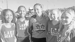  ?? BUDDY COLLINGS/STAFF ?? Lake Mary's Mya Bodrato, second from left, celebrated her 3,200-meter title with teammates, from left to right, Lyra Winn, Cheyenne St. Lewis, Maggie Lyons and Evie Erikson.