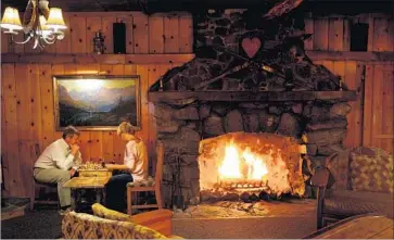  ?? Wally Skalij Los Angeles Times ?? MAMMOTH LAKES employs three full-time workers to identify short-term rentals and ensure they pay the city’s transient occupancy tax. Above, Rich and Vicki Vaught of Long Beach at Tamarack Lodge in 2015.