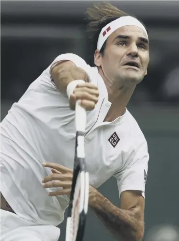  ??  ?? 0 Roger Federer serves on his way to a comfortabl­e win over Slovakia’s Lukas Lacko on Centre Court.