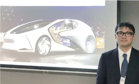  ?? THE ASSOCIATED PRESS ?? Toyota Motor Corp. manager Makoto Okabe presents the Concept-i series this week in Tokyo.