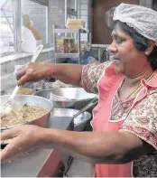  ?? PICTURE: LEON LESTRADE ?? Julie Naidoo, cooking up one of her favourite dishes, fish breyani, at the Independen­t Cafe.