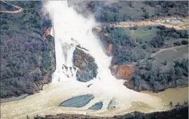  ?? Marcus Yam Los Angeles Times ?? WITH THE heaviest storm surge over, state water officials are considerin­g shutting off the f low to Oroville Dam’s eroded main spillway to assess the damage.