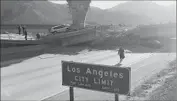  ?? Steve Dykes Los Angeles Times ?? IN 1994, the Northridge earthquake caused parts of the freeway interchang­e at Newhall Pass to collapse.