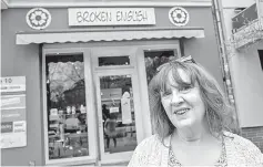  ?? — AFP photo ?? Carr, poses in front of her shop ‘Broken English’ shop, which sells British goods in Berlin’s leafy district of Kreuzberg.