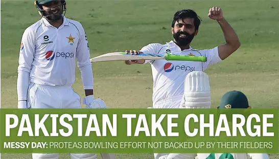  ?? Picture: AFP ?? STRIKE A POSE. Pakistan’s Fawad Alam celebrates with team-mate Faheem Ashraf after scoring his century during the second day of the first Test against the Proteas in Karachi yesterday.