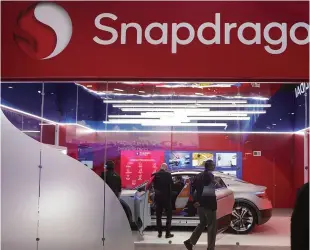  ?? ?? Visitors check out a concept car, which is displayed at the Qualcomm booth company’s Snapdragon Digital Chassis technology, at CES 2024.