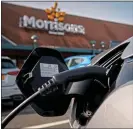  ?? ?? DRIVE-THRU: Supermarke­ts now offer cheap electric vehicle charging