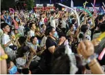  ??  ?? People participat­ing in a music festival in Wuhan in China’s central Hubei province.