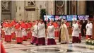  ??  ?? Cardinals wore face masks for the most of the ceremony