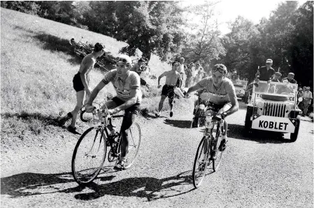  ??  ?? Hugo Koblet rides past Ruiz at the 1951 Tour, with the Swiss going on to win overall